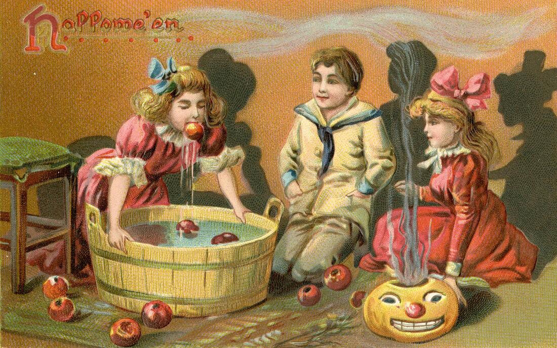 Halloween postcard featuring White children in 19th century dress kneel before a wooden tub of water with apples floating - one blonde girl in a pink dress has an apple in her mouth dripping as she leans over the tub.